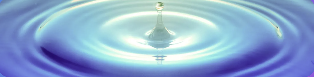 A single drop of water falling into a still blue pool, sending gentle concentric ripples outward